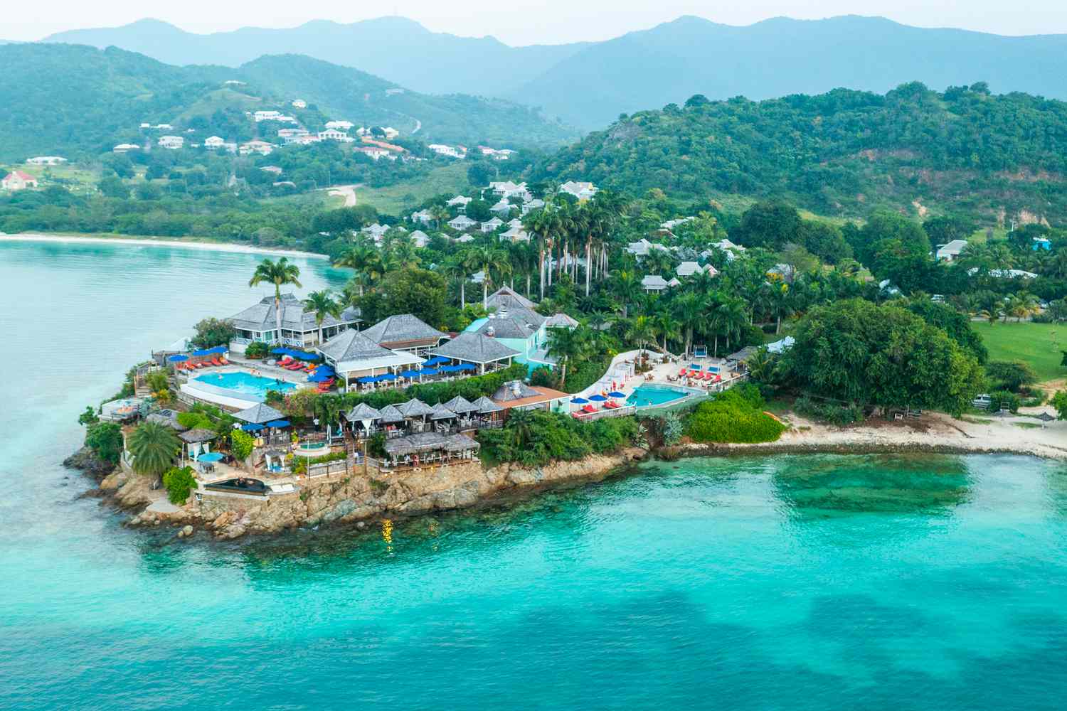 Tropical beach with clear blue water and white sand